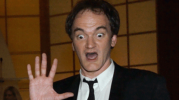 Quentin Tarantino with a surprised expression on his face.