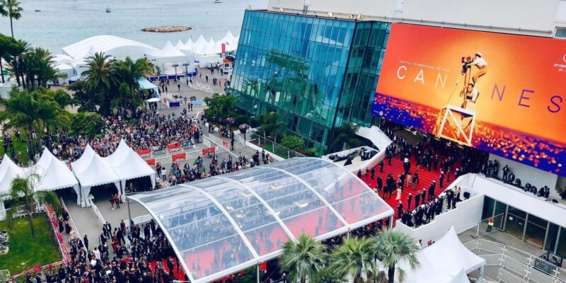 A bird's-eye view of the bustling crowd at the Cannes Film Festival, filled with anticipation and excitement.