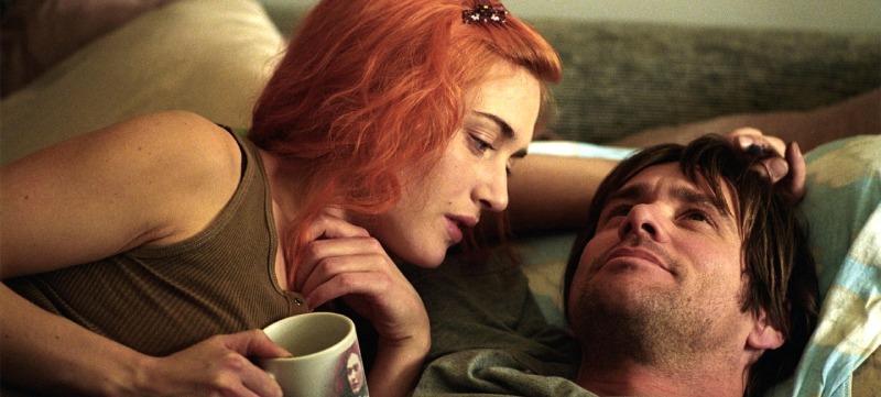 Eternal Sunshine of the Spotless Mind, two people, Joel and Clementine, lying in a bed and looking at each other thoughtfully.