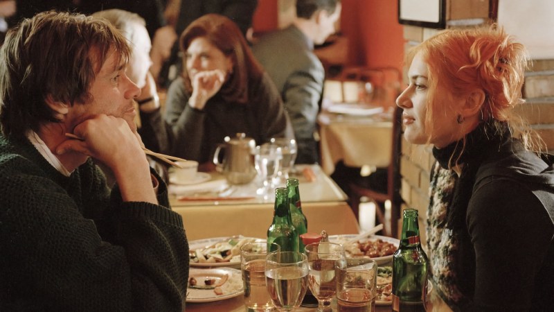 Eternal Sunshine of the Spotless Mind, two people, Joel and Clementine, sitting at a table and having dinner together.