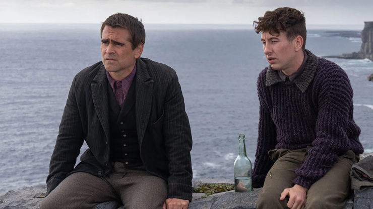 Pádraic Súilleabháin (Colin Farrell) and Dominic Kearney (Barry Keoghan) from 'The Banshees of Inisherin' enjoying a serene moment by the beach.