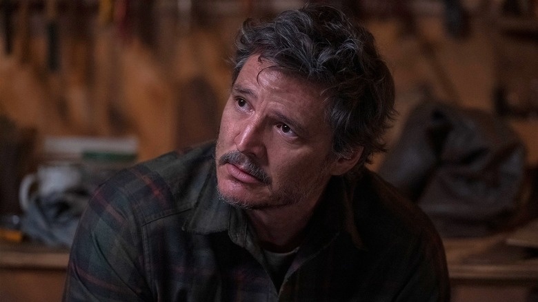 Pedro Pascal as Joel Miller looking exhausted in The Last of Us