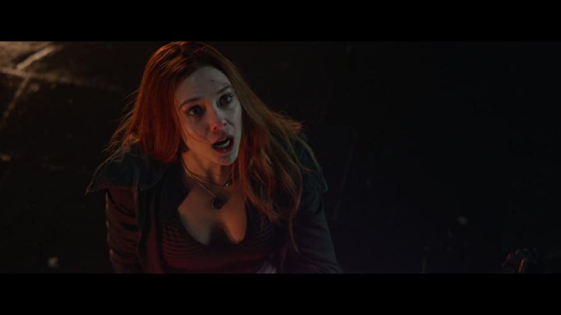 Scarlet Witch, with a hint of anger in her eyes, channels immense power in a scene from Avengers: Infinity War.