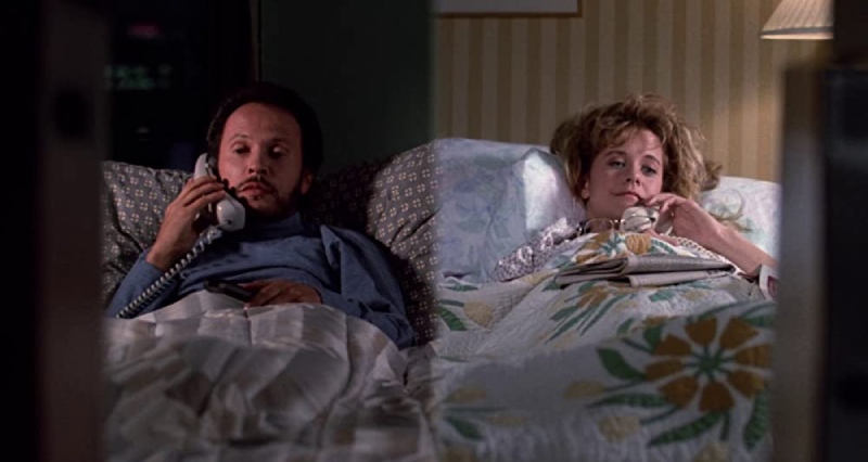 Split screen image of Harry and Sally lying in their beds and talking on the phone in a scene from When Harry Met Sally.