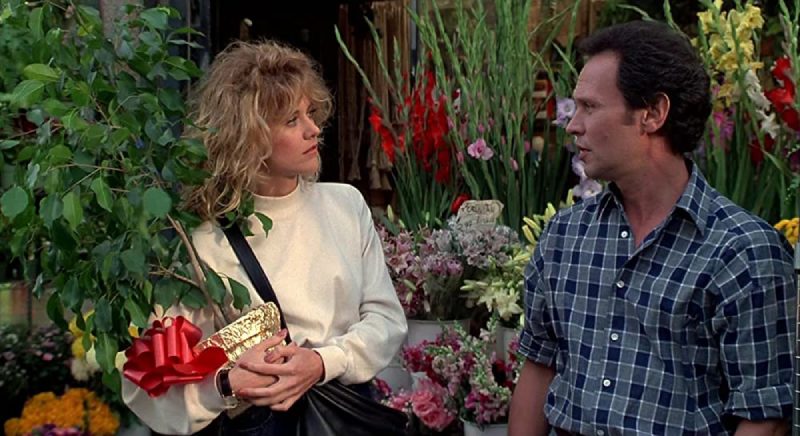 Image of Sally holding a flower pot and looking at Harry in a scene from the movie When Harry Met Sally.