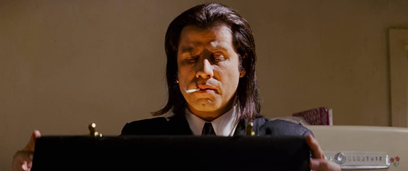 Image of a glowing suitcase being opened, revealing a mysterious and bright light, from the movie Pulp Fiction.