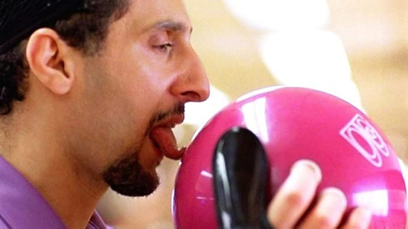Jesus Quintana (played by John Turturro) licking a bowling ball with enthusiasm.