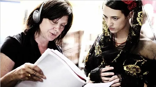 Catherine Breillat, the acclaimed filmmaker, engages in a focused text reading session with her actress, discussing the nuances of the script.