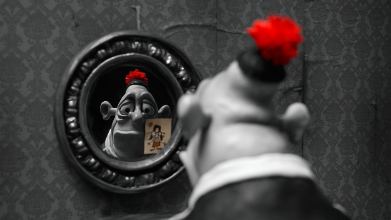 Max Jerry Horovitz from the movie "Mary and Max" looks at himself in the mirror.