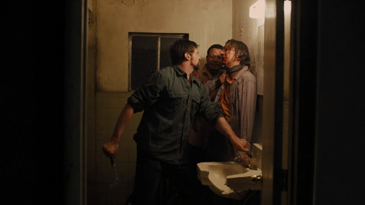 Keller Dover (Hugh Jackman) from the movie Prisoners beats up the suspect. The suspect's face was covered in blood.