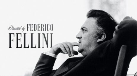 Federico Fellini leans back in his chair, hand to his mouth, with the caption 'Directed by Federico Fellini' visible in the photo.