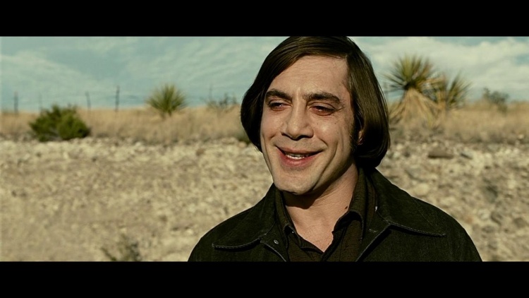 Javier Bardem as Anton Chigurh, wearing a chilling smile in 'No Country for Old Men'.