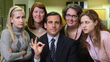 Group photograph featuring the female actors from the TV series 'The Office,' with Michael Scott at the center.