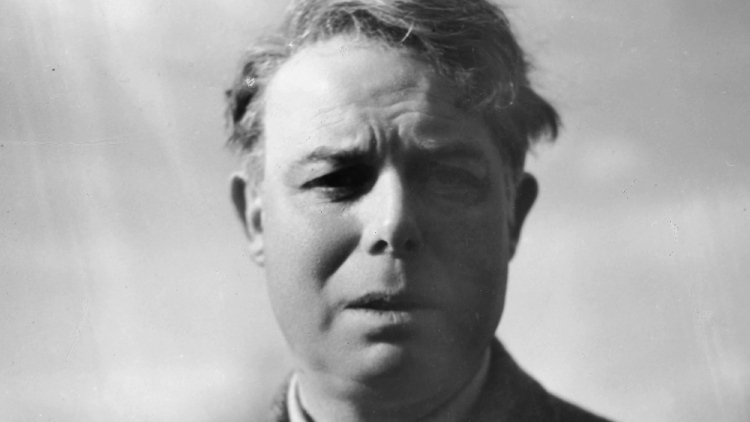 Jean Renoir appears contemplative, gazing with a thoughtful expression, as if seeking to understand something.