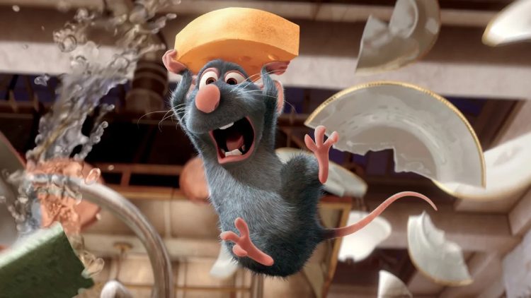 Remy, the character from Ratatouille, leaps for joy while holding a slice of cheese in his tiny hand.