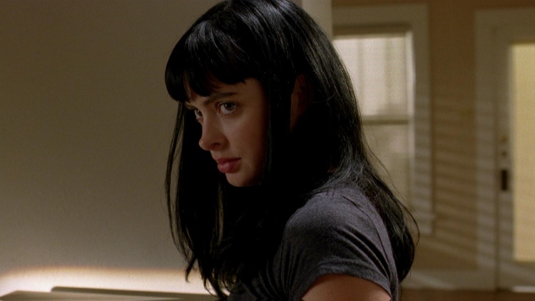 Krysten Ritter, portraying Jane Margolis in Breaking Bad, casts a subtle sideways glance, revealing a complex emotion.