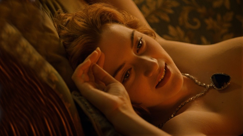 Kate Winslet, as Rose Dewitt Bukater in the film Titanic, poses unclothed for Leonardo DiCaprio's character, Jack Dawson, to create her portrait.
