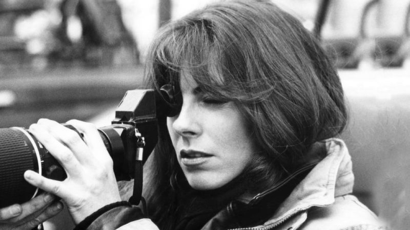 Kathryn Bigelow, the accomplished director, peers through the camera viewfinder, framing a shot with precision.