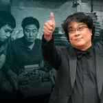 10 Signature Elements of Park Chan-wook's Filmmaking Style! Director Park Chan-wook in a stylish tuxedo, standing proudly in front of the movie poster for "Parasite"