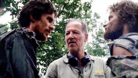 A behind-the-scenes moment from the movie "Rescue Dawn" featuring director Werner Herzog preparing actors Steve Zahn and Christian Bale for their roles.