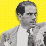 10 Signature Elements of Frank Capra Filmmaking Style! Director Frank Capra leans casually, hand on the stair railing, evoking a moment of contemplation and ease.