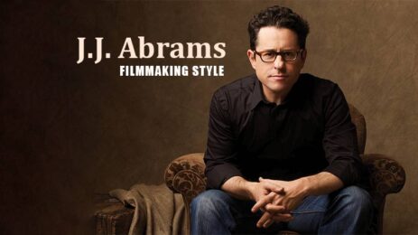 Director J.J. Abrams seated, clasping his hands and leaning forward slightly, with the text "J.J. Abrams filmmaking style" on the image.