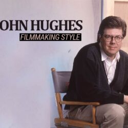 Director John Hughes seated in the director's chair, accompanied by the text "John Hughes filmmaking style."