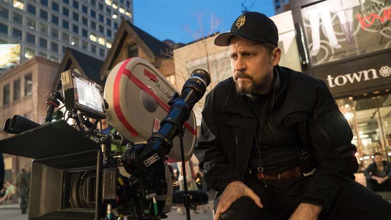 Director David Ayer on the movie set, with Panavision camera positioned behind him, actively directing a movie.