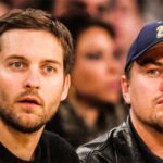 Tobey Maguire and Leonardo DiCaprio — What's the Real Story Behind Their Bromance? Tobey Maguire and Leonardo DiCaprio sharing a moment, watching a match together, exemplifying a heartwarming bromance.
