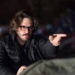 10 Signature Elements of Edgar Wright's Filmmaking Style! Director Edgar Wright on the film set, directing a scene as he points with his index finger.