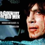 "No Country for Old Men" Explained: Explore 14 Hidden Messages and Symbolism! Javier Bardem as Anton Chigurh gazes menacingly through a broken car window in No Country for Old Men. The image includes the text 'No Country for Old Men hidden messages & symbolism.'